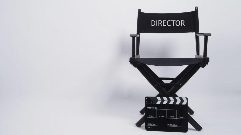 A black director's chair with a backrest and a large "DIRECTOR" printed on the back. learn filmmaking online
