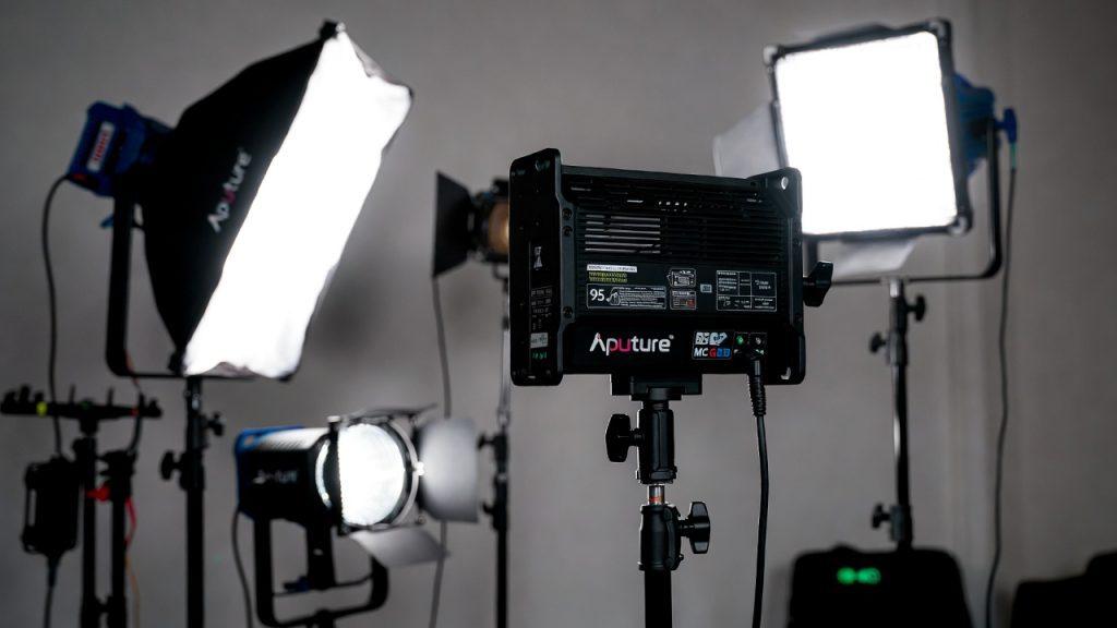 Upgraded mid-budget lighting equipment ($500–1500) focused on color accuracy: Aputure MC RGB for versatile accent lighting, high-TLCI panels and fresnel spotlights (CRI/TLCI >95) to ensure colors render correctly on camera sensors with minimal correction needed, 5-in-1 collapsible reflector for bounce/fill, dedicated diffusion fabrics, and gel pack for temperature or creative adjustments—key tools for matching footage, creating specific moods, and achieving broadcast-quality results without high-end expense.