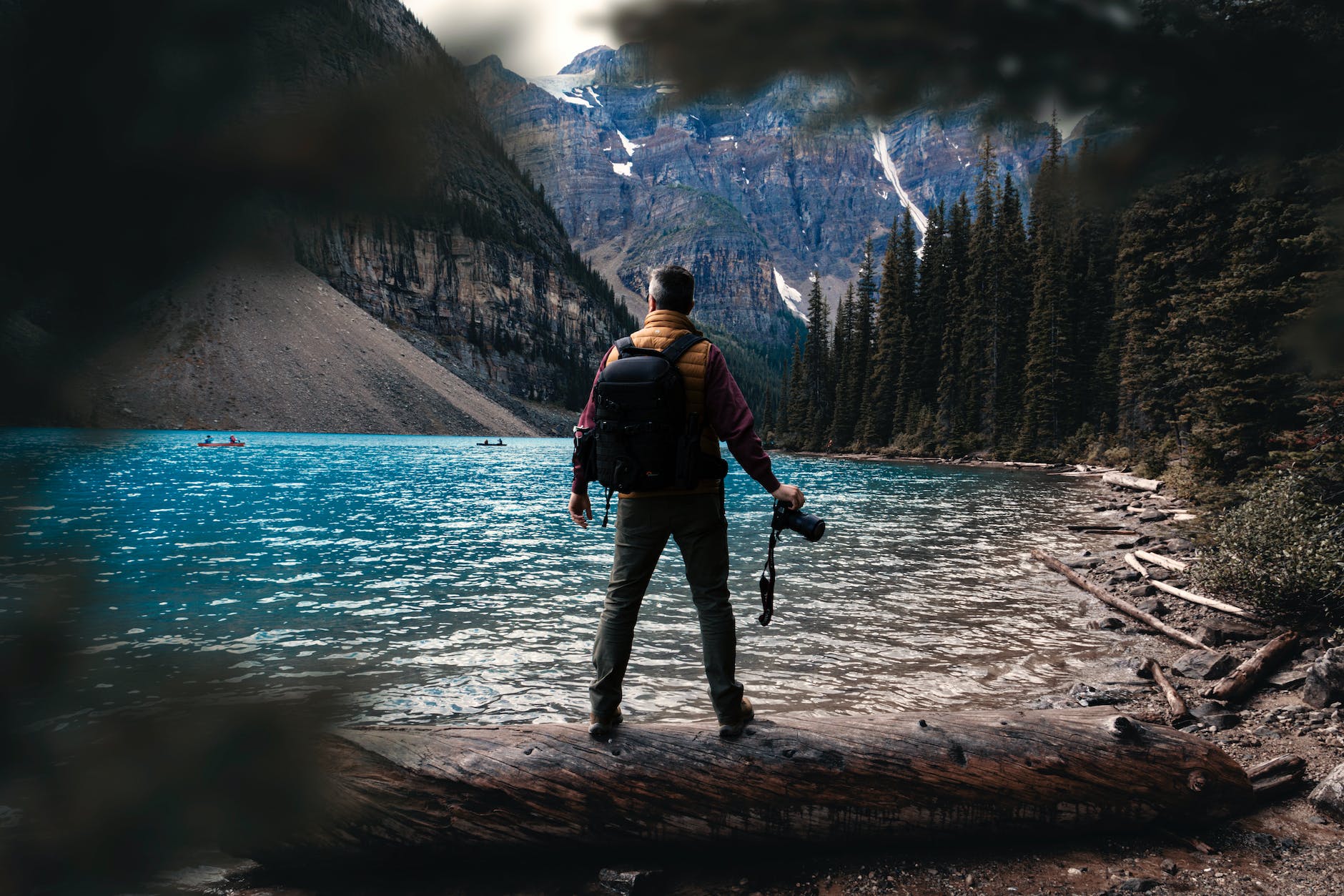 man standing near water