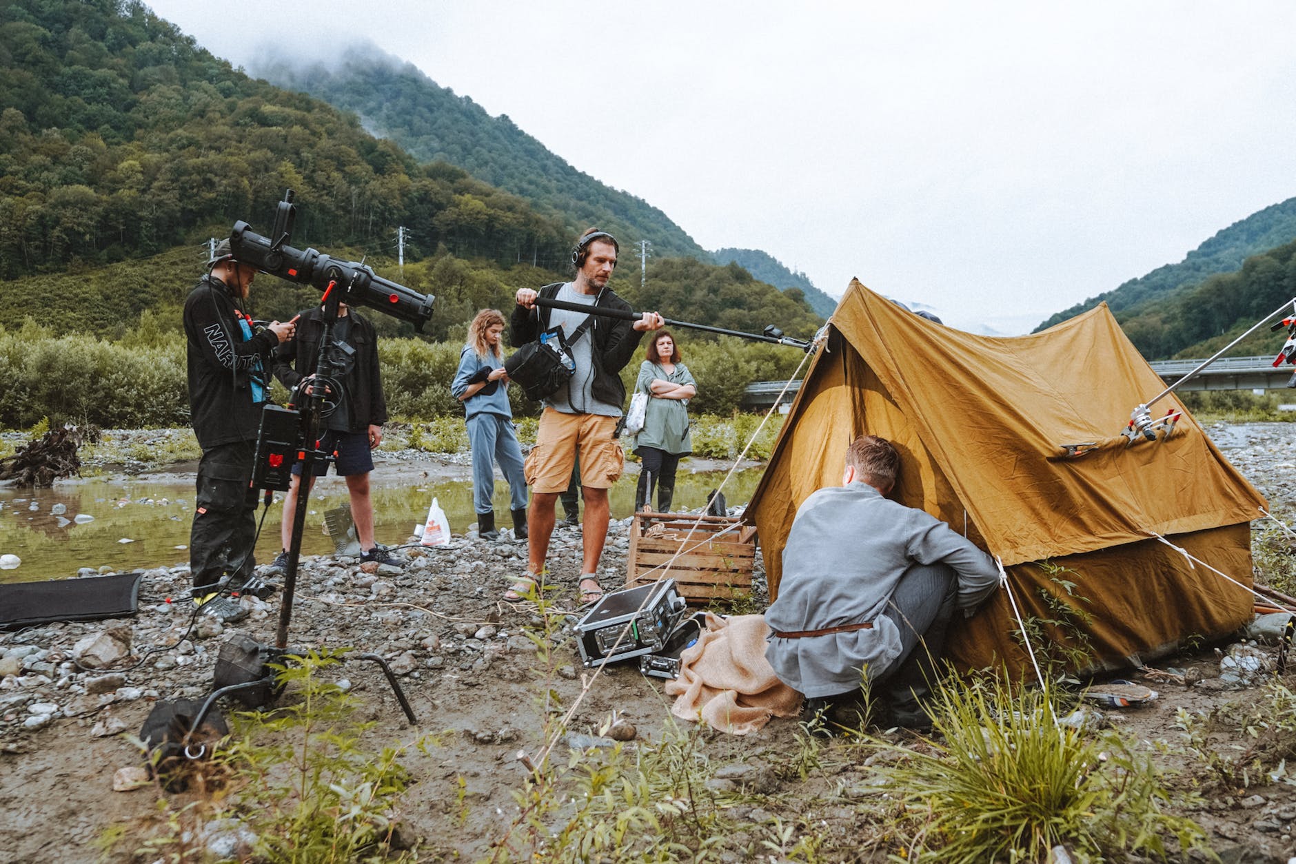 film crew and a set up tent in mountains