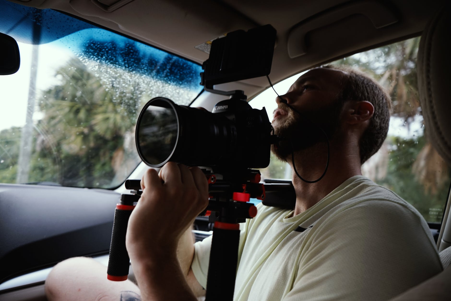 man holding dslr camera