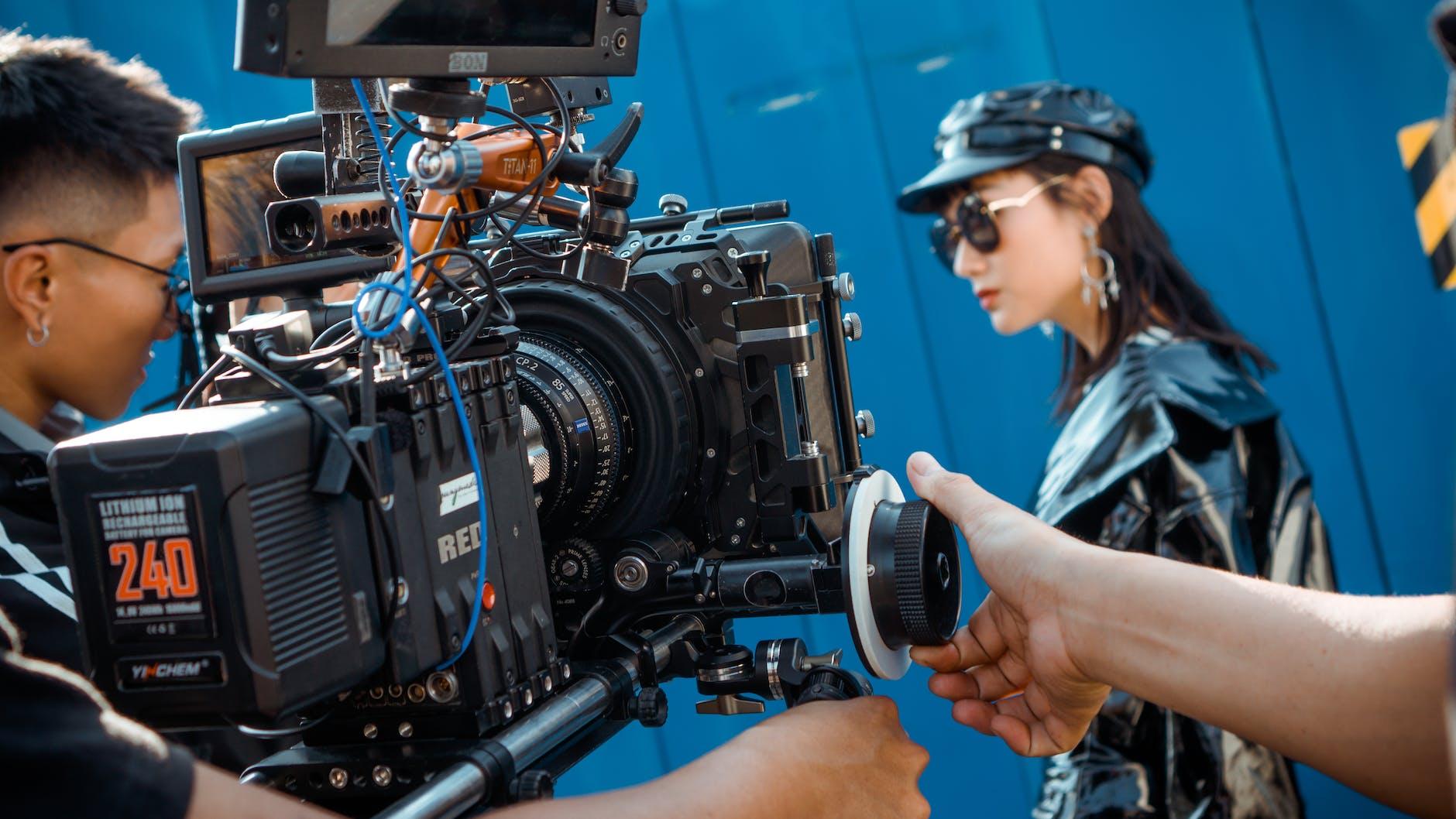 Unveiling the Filmmaker's Journey: From Rejection to Triumph-photo of men holding camera