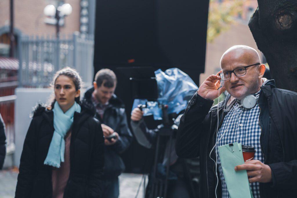 Directing actors on set - Director and actor talking about the next scene for the film "going home"