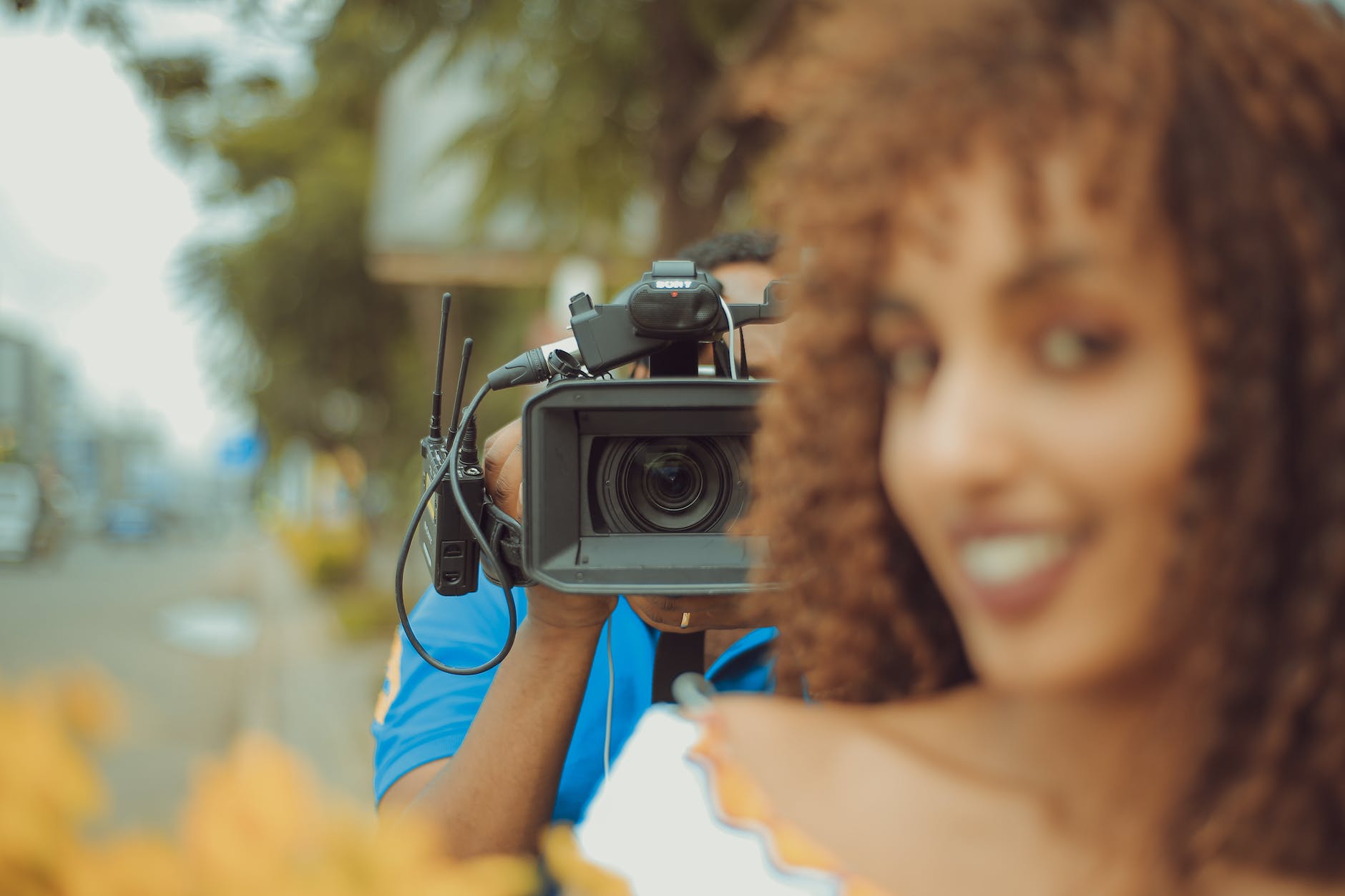 man holding camera with stand