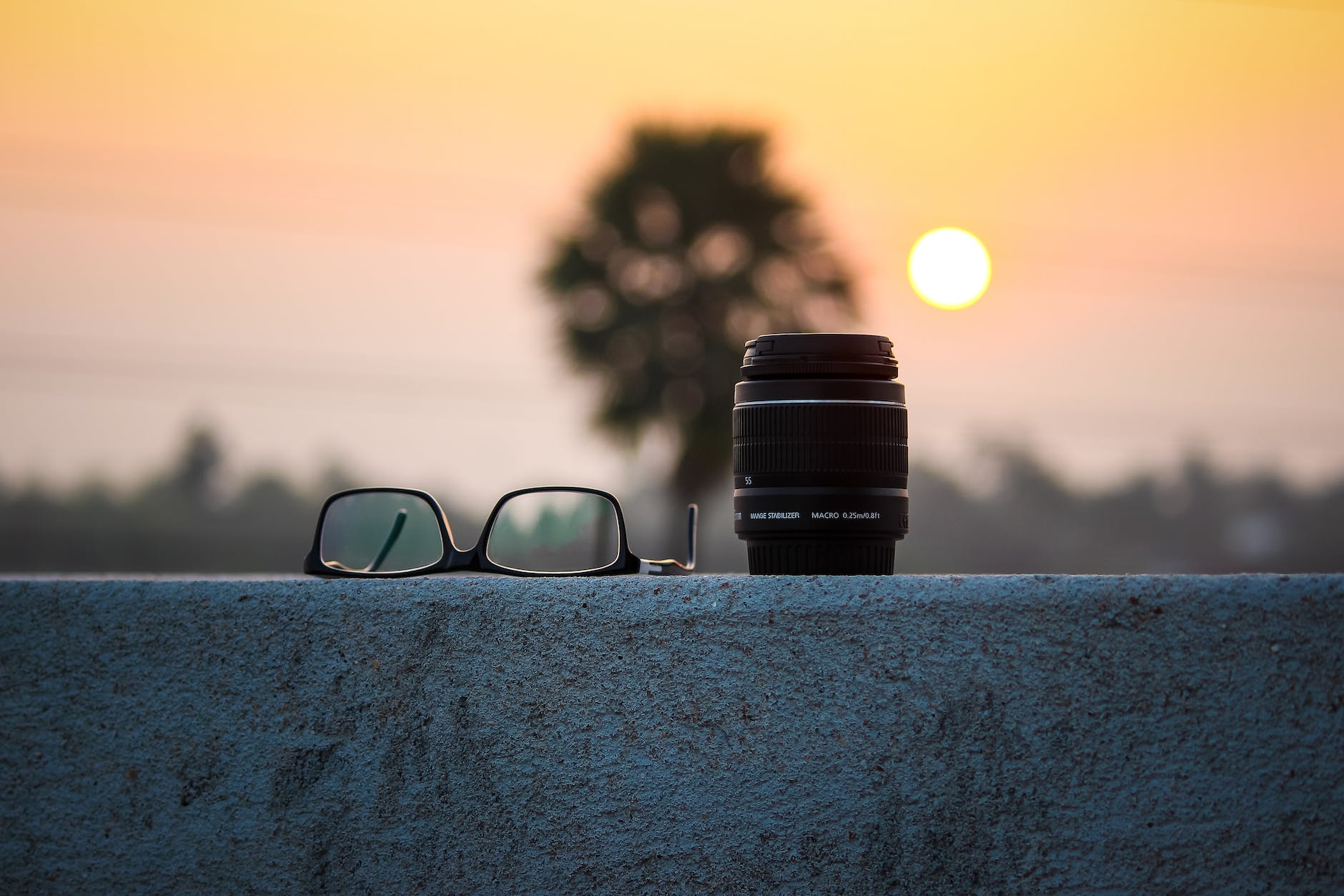 black camera lens and eyeglasses