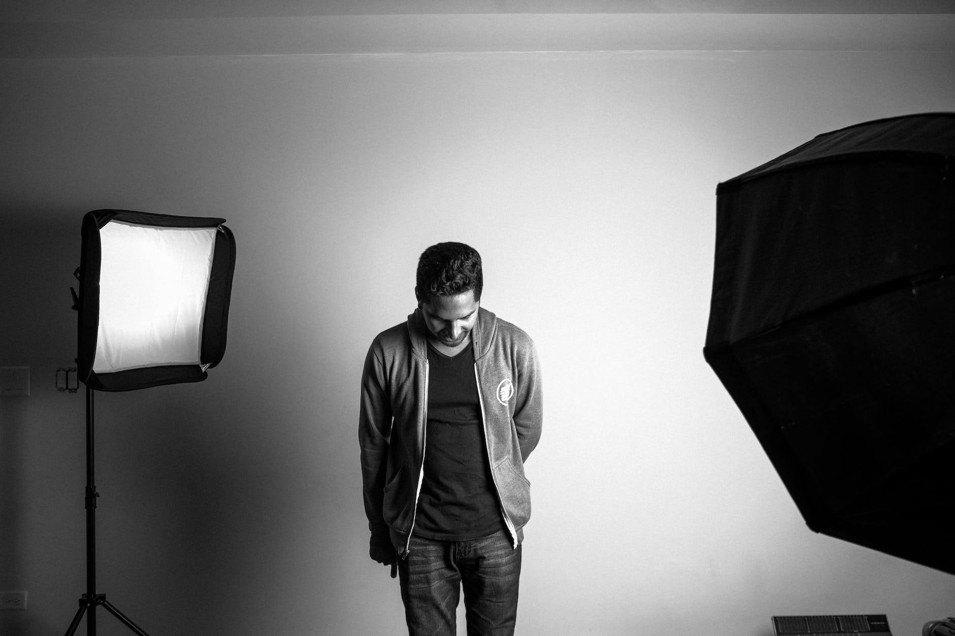 Directing Dialogues: Tips for Crafting Authentic Conversations-grayscale photography of standing man in studio
