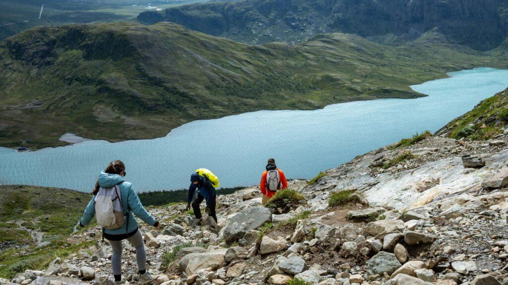 hikers descending mountain trail