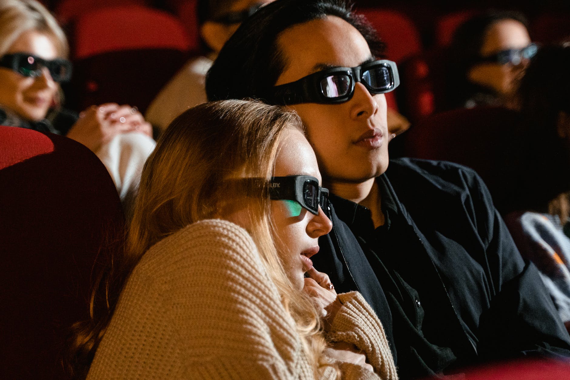 a couple sitting in a movie theater
