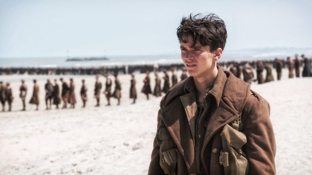 Thumbnail image for 'Dunkirk Christopher Nolan Sand Beach Soldiers Landscape' video: A sweeping panoramic shot of a beach landscape from Christopher Nolan's film 'Dunkirk,' featuring soldiers amidst the sandy terrain and the vast expanse of the horizon.