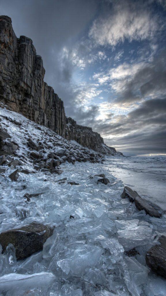 IMAGE SUGGESTION: The final Iceland image - ice chunks, basalt columns, dramatic sky