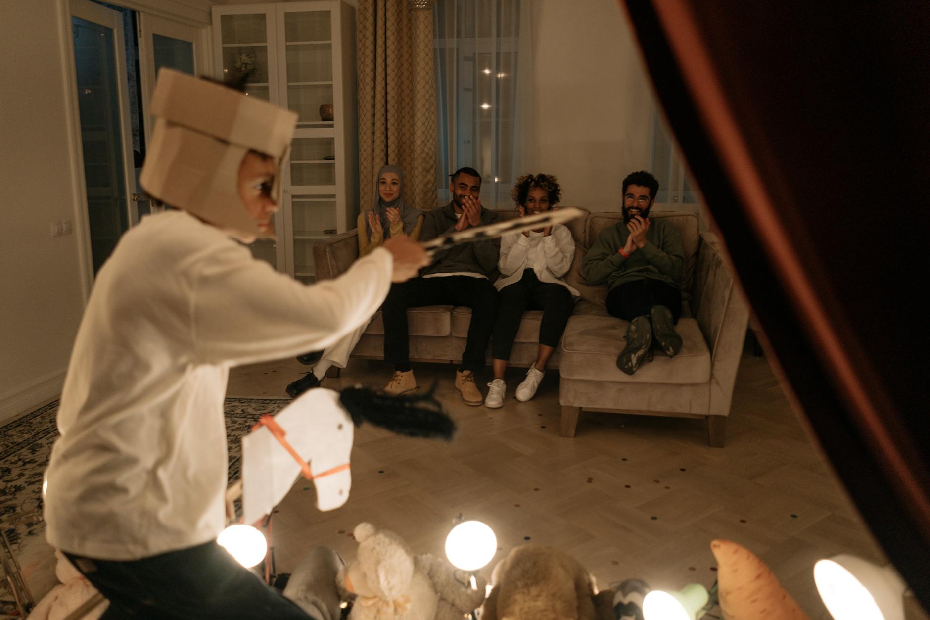 The Art of Collaboration: Directing Experienced Actors - group of people sitting on couch while watchinig a boy s performance