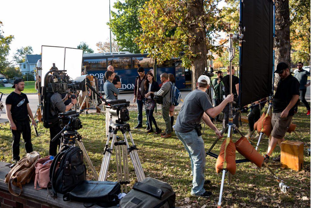 film actors on a film set with director