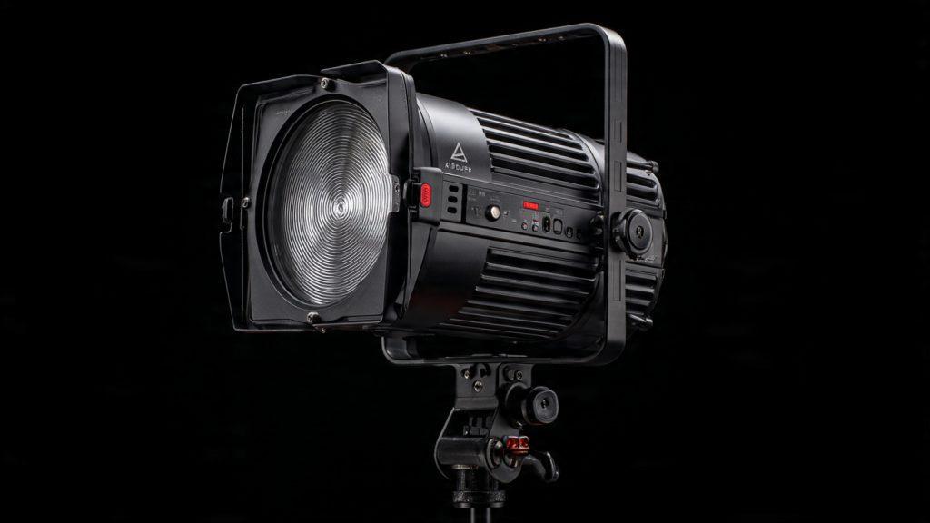 Aputure 600D Pro LED light with Bowens mount, control box, yoke, and cooling system, professional product photography on a dark background, high detail, studio lighting, 16:9 aspect ratio