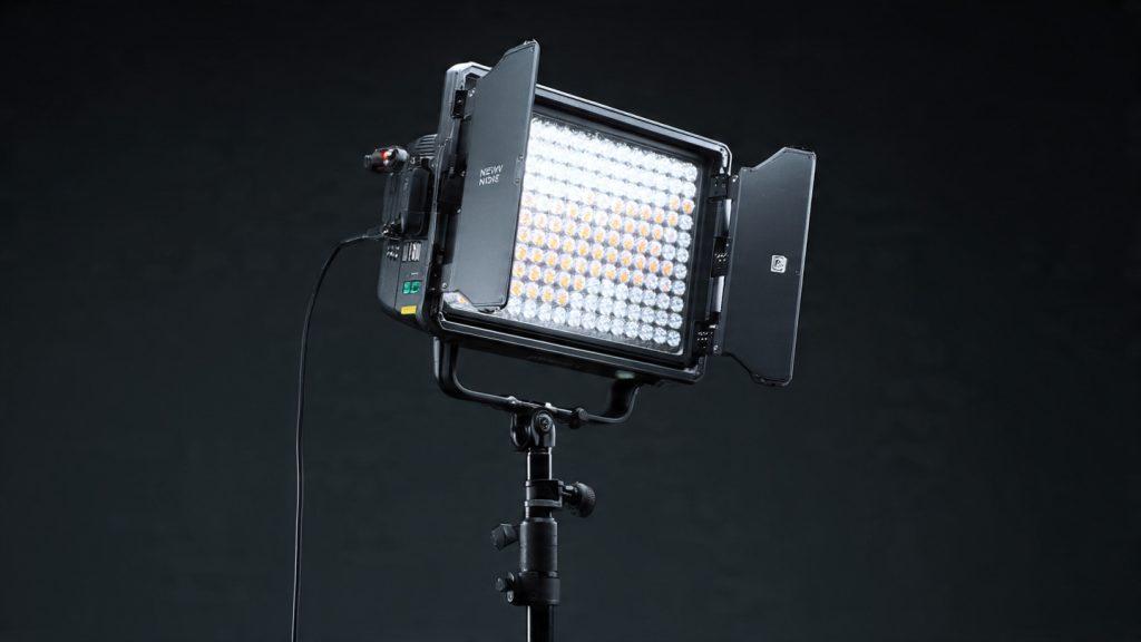 Neewer 660 LED Panel professional video light with barn doors, control panel, and yoke mount, product photography style on a dark background, high detail, studio lighting, 16:9 aspect ratio