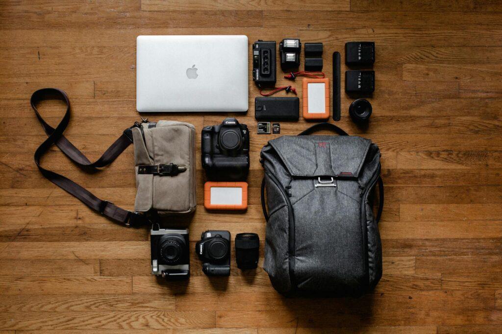 Luggage for Filmmakers: top view photo gadgets on hardwood floor