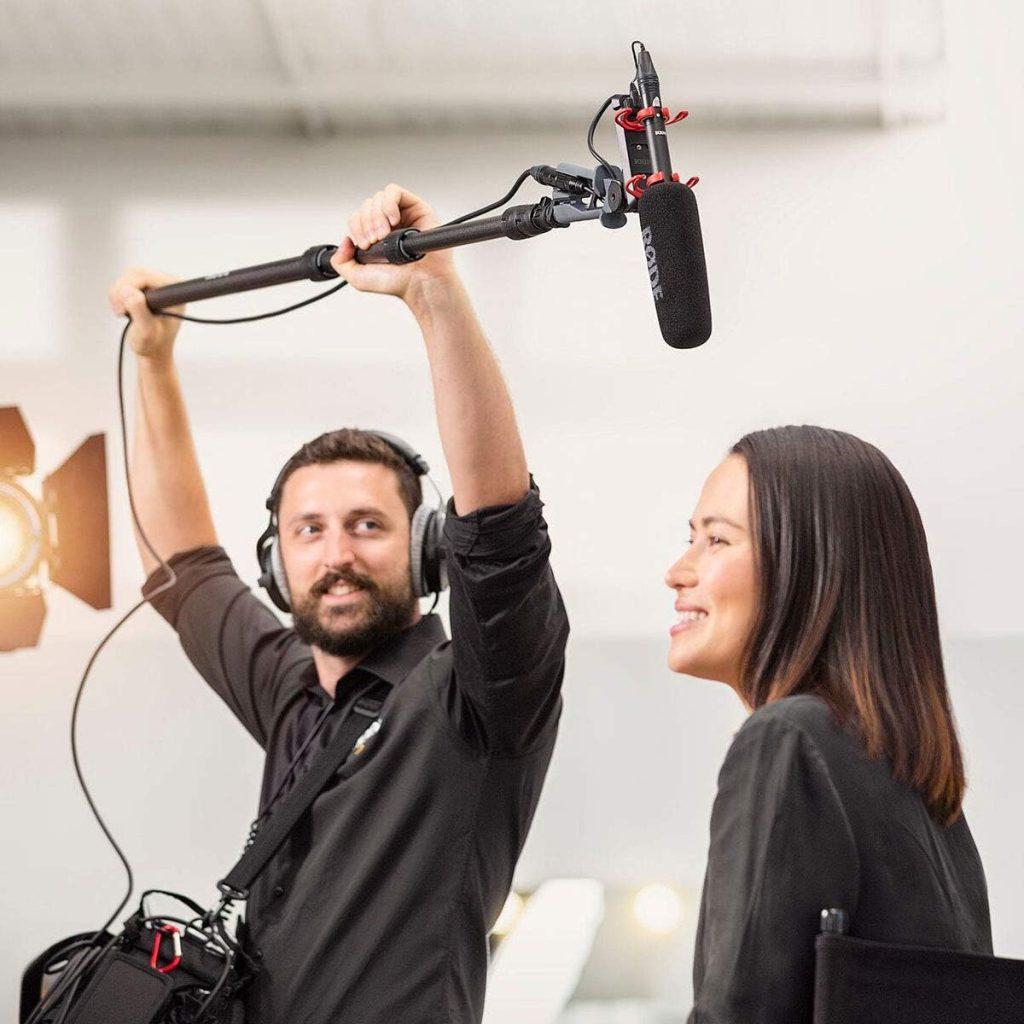 Rode VideoMic NTG on a boom overtop a person being interviewed