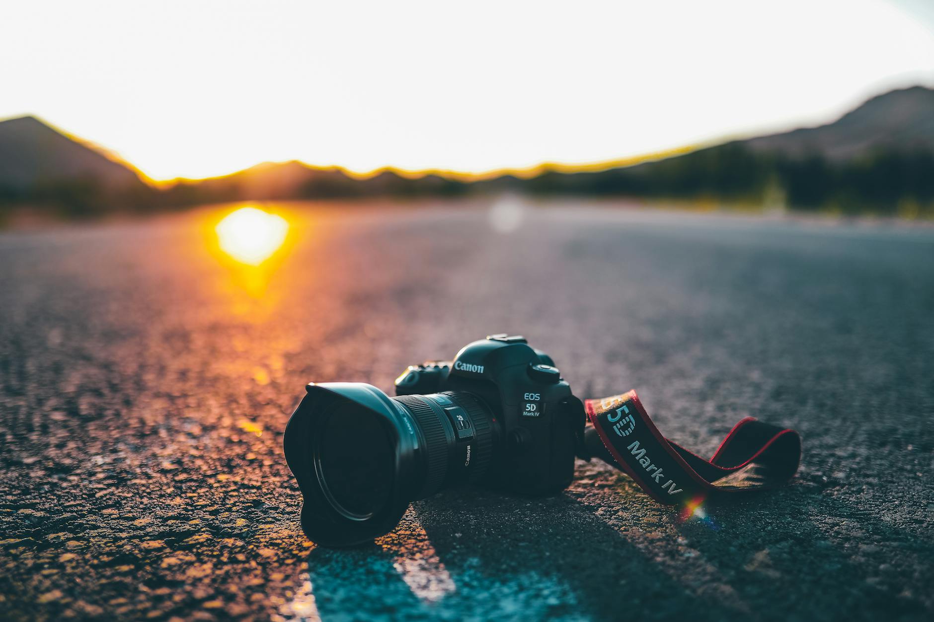 travel filmmaking gear black dslr camera on concrete road
