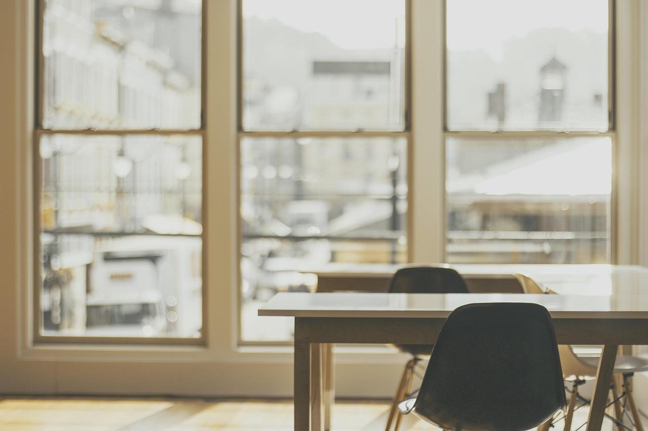 A bright, clean workspace with morning sunlight streaming in.