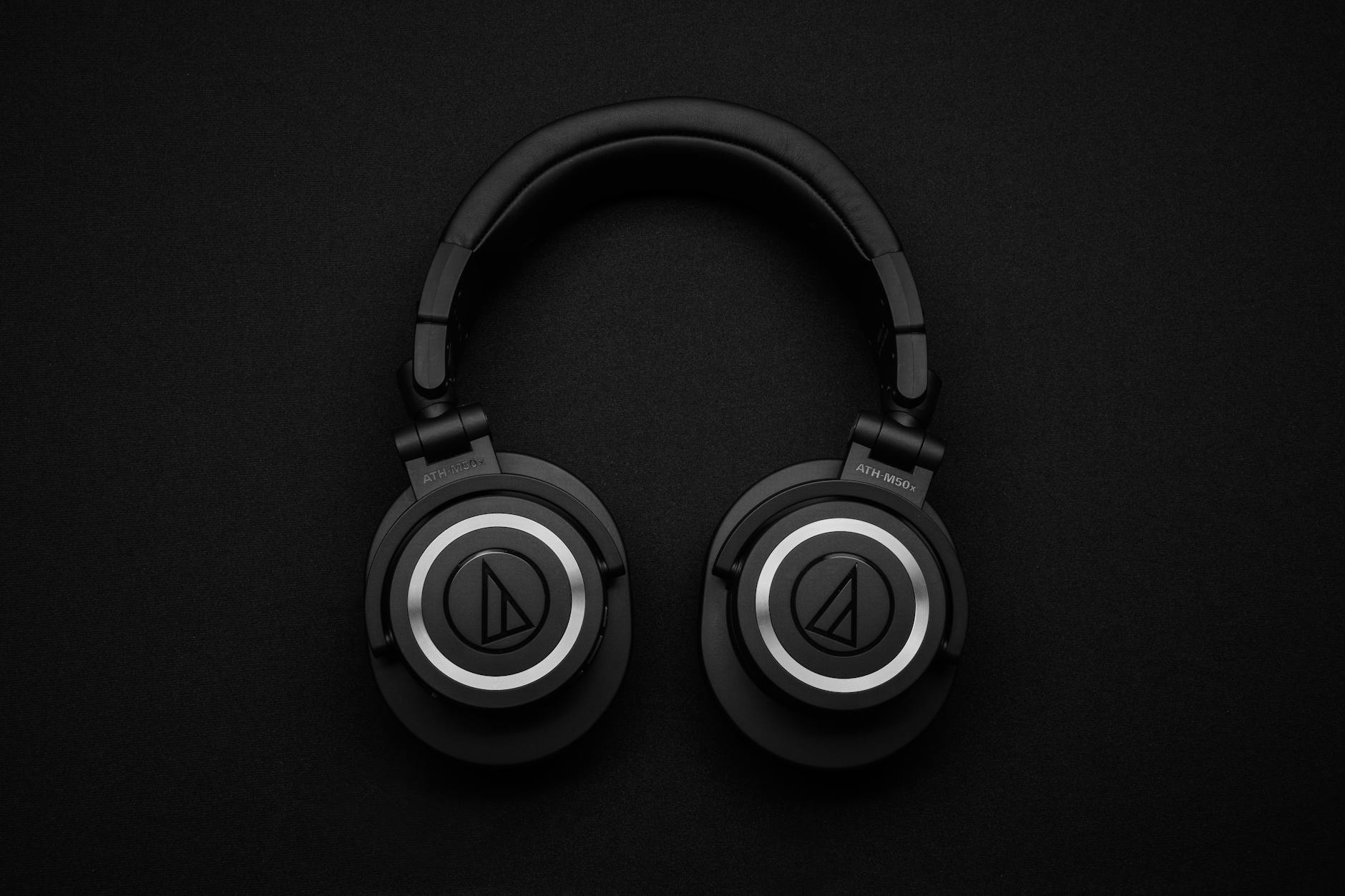 spatial audio top view photo of black wireless headphones