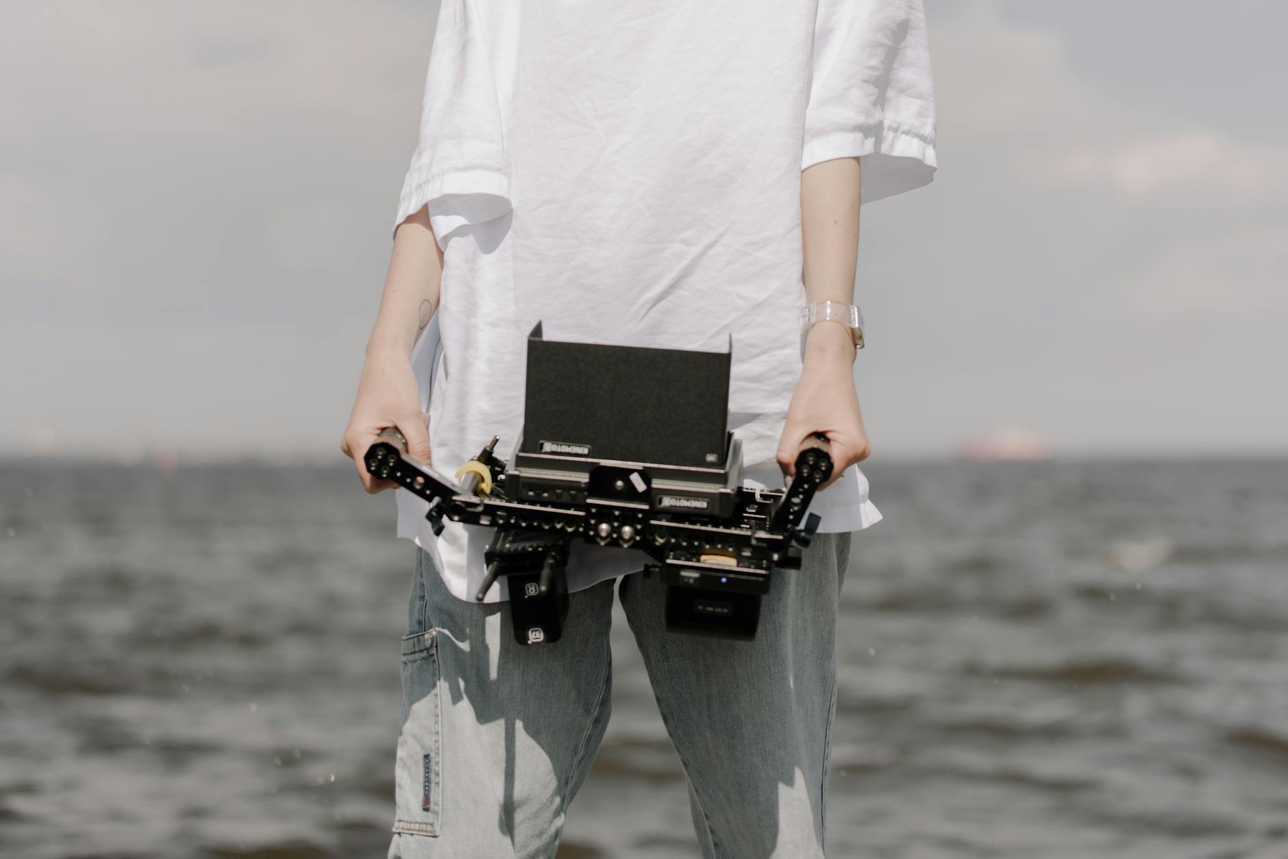 a person with a camera holder Smartphone Filmmaking Rig That Looks Professional on Set
